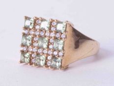 A 9ct square dress ring set with 9 stones, 5.6g.