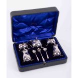 A five piece silver condiment set, with 3 spoons, maker 'GN.RH' , approx 6oz, cased.