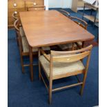 A McIntosh retro teak dining table (160cm x 90cm closed) double leaf extension with six dining