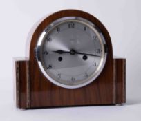 Enfield, a walnut cased eight day mantel clock with gong strike.