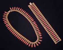 An Indian style coral effect and gilt bracelet and matching necklace.