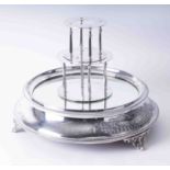 An early 20th Century silver plated and mirrored wedding cake stand together with two tiers,