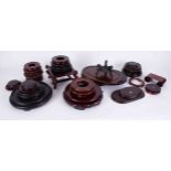 A collection of 20th Century carved wood Oriental pot stands, (approx. 12).