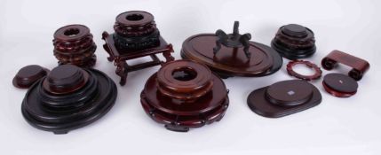 A collection of 20th Century carved wood Oriental pot stands, (approx. 12).