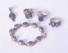 A small collection of silver and other jewellery, bracelet, three rings and a pendant.