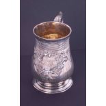 A Victorian silver tankard, gilt lined, the cartouche decoration with monogram, date inscribed '13th