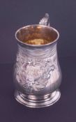 A Victorian silver tankard, gilt lined, the cartouche decoration with monogram, date inscribed '13th