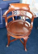 A heavy early 20th Century mahogany captains swivel chair.