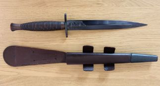 A post WW2 Wilkinson Sword pattern three Fairbairn Sykes Commando Knife, it comes with a 16.4cm long