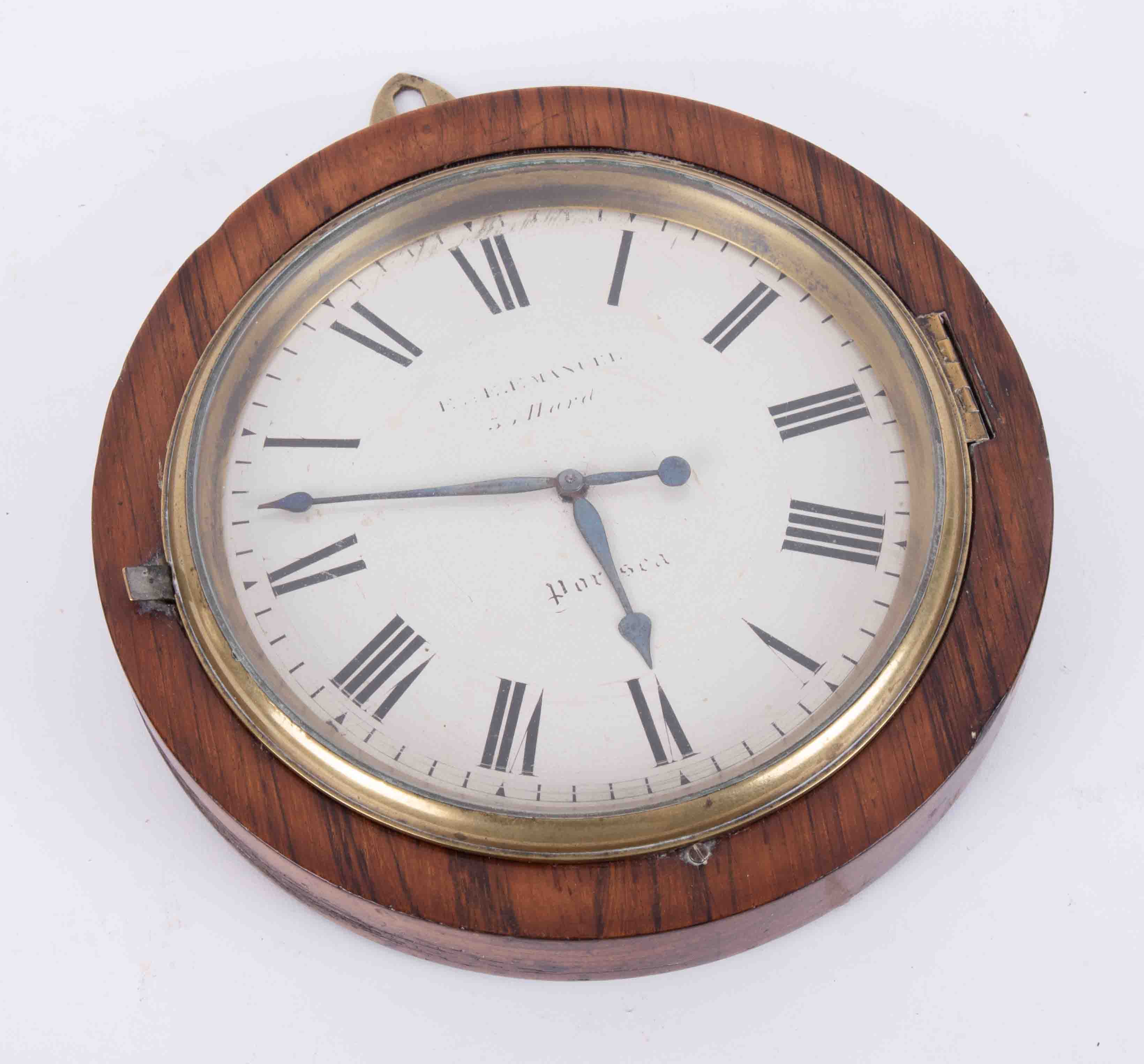 A 19th century rosewood framed circular wall clock, marked 'E. Emanuel, Portsea?' the pocket watch