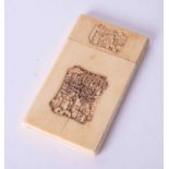 An antique Chinese carved ivory card case decorated with a panel of figures, 9.5cm x 5.5cm.