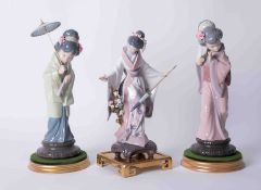 Lladro, three Oriental figures on stands, the tallest approx. 30cm, all boxed.