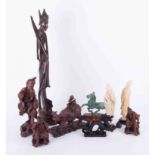 A collection of 20th century Oriental carved hardwood figures, replica of the antique racing horse