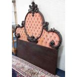 A large carved mahogany headboard, width 170cm.