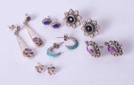 A bag of six pairs of silver earrings including silver & amethyst drop earrings, ornate silver