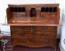 A Georgian mahogany secretaire chest, the upper drawer with a fitted interior over four long