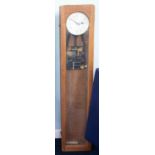 Synchronome, London, on oak cased electric master wall clock (lacks pendulum), height 127cm x 27cm.