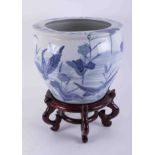 A large 20th century Chinese blue and white planter on stand, height 30cm.