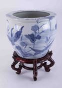 A large 20th century Chinese blue and white planter on stand, height 30cm.