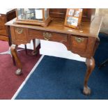 An early 19th Century oak low boy with inlaid decoration fitted with three drawers, shaped legs on