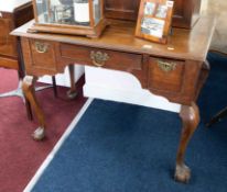 An early 19th Century oak low boy with inlaid decoration fitted with three drawers, shaped legs on