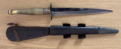 A WW2 Pattern Two Fairbairn Sykes Commando Knife, the blade is blued and the guard has the marking