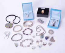 A collection of "silver" modern jewellery, various necklaces, brooches, pendants, earrings, etc,