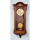 A mahogany cased and inlaid wall clock with key, of Vienna style.