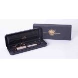 A cased set of Parker Duofold comprising two 18ct nibbed fountain pens, cased with outer box.