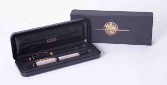 A cased set of Parker Duofold comprising two 18ct nibbed fountain pens, cased with outer box.