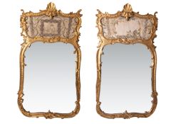 A pair of large Trumeau style gilt framed mirrors decorated with embellished silk work sections (one