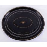 A large 19th century oval black lacquered tray, with gilt work and inlaid,, width 74cm.