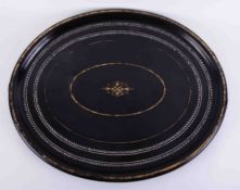 A large 19th century oval black lacquered tray, with gilt work and inlaid,, width 74cm.