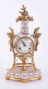 A Victorian & Albert Museum reproduction 'Marie-Antoinette' clock in porcelain with gilt