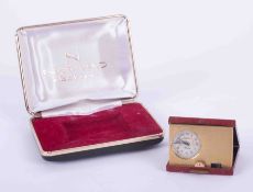 A Nepro electronic miniature travel alarm clock, cased.