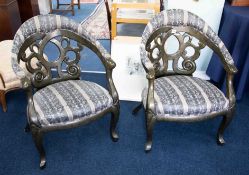 Pair of modern designer elbow chairs.