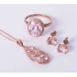 A modern 9ct rose gold suite of jewellery comprising a single stone earring, pendant and a pair of