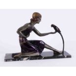 An Art Deco style sculpture, after D.H.Chiparus, a seated lady holding a parrot, 47cm x 15cm
