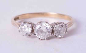 A 9ct three stone diamond effect ring with indistinct marks.