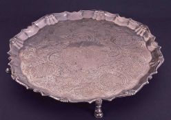 A silver salver, indistinct hallmark London, RA? Diameter 30cm with engraved decoration, gadrooned