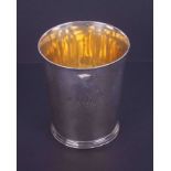 A Georgian silver beaker, gilt lined, indistinct hallmarks, height 9.5cm, 5.39oz