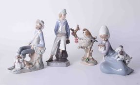 Lladro, four Lladro figures including sailor boy, bird & nest, the tallest 24cm.