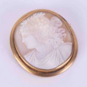 A large yellow gold? (no hallmarks) cameo brooch with safety chain, 6cm x 5.5cm, 23.23g.