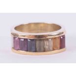 9ct yellow gold channel set ring with multi-colour emerald cut gemstones including pink sapphire,