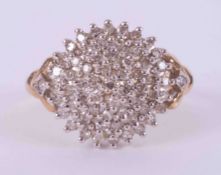 A 9ct yellow gold diamond cluster ring set with approx. 0.50 carats of round brilliant cut diamonds,