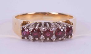 An 18ct yellow & white gold ring set with five round cut rubies, total weight approx. 0.50 carats