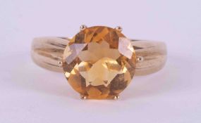A 9ct yellow gold ring set with a round cut citrine? approx. 3.90 carats, 3.87g, size P.