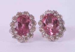 A pair of 18ct & 9ct white gold cluster earrings set with oval cut pink tourmalines? approx. total