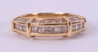 An 18ct yellow gold half eternity style ring set with a mixture of princess cut & round brilliant