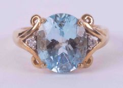 A 9ct yellow gold ring set with an oval cut blue topaz, approx. 5.00 carats with one small